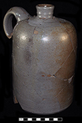 Grey bodied salt glaze stoneware jug. ¾ gallon capacity. The straight sides and definite shoulder on this vessel suggest that it was made after circa 1850. Vessel height: 10:00”, Vessel body diameter: 6.00”, Vessel V-11 from 18MO609.