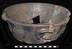Grey bodied salt glazed stoneware bowl with a pulled spout and cobalt blue painting. Vessel has two lug handles. Rim diameter: 11.00”, Vessel V-12 from 18MO609.