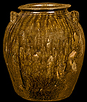 North Carolina alkaline-glazed stoneware five-gallon jar, late 19th century. This vessel displays the drips and runs that can characterize some alkaline glazes. Vessel height: 14.25“.
