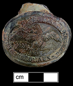 Olive oil bottle seal molded with an eagle with outstretched wings astride an olive branch.  The eagle holds a ribbon in its mouth molded with the words “Grolin’s Superfine Bordeaux Olive Oil”, 56 x  36 mm diameter - from 18BC33.