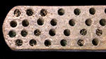 Bone handled toothbrush with gradual neck. Rounded square stock, handle has flat oval cross section; rounded base, with wire drawn bristle attachment. 1G.448.12 18BC38