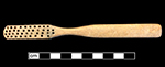 Bone handled toothbrush with gradual neck. Rounded square stock, handle has flat oval cross section; rounded base, with wire drawn bristle attachment. 1G.448.12 18BC38