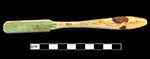 Bone handle with teardrop shape toothbrush with wire drawn attachment and copper alloy staining on back. Stamped on front: “England” near stock and “Hochschild Kohn & Co. Baltimore” and “Drawn Wire/Sterling/Silver Wire” on handle. 18BC92
