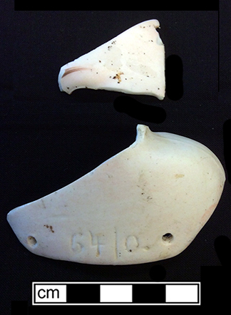 Molded and painted bisque porcelain doll head and shoulder fragments. 18BC80
