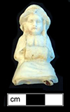 Small sitting doll, made of bisque porcelain, with the legs broken off. 4.75cm x 2.75cm x 3cm, from 18BC27.