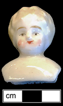 Low brow style porcelain doll head, typical of the 1890s. This porcelain head would have been attached to a cloth body and would have had porcelain arms and legs. 18BC80