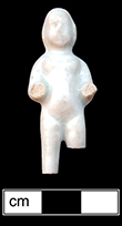 Small Frozen Charlotte doll, with traces of red paint in her hair - from 18MO609.