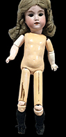 This complete doll, similarly marked, has a wooden and composition body.  Height 17.5”. Private collection.