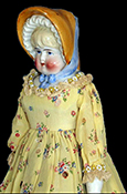 Painted hard paste porcelain Bonnet doll. Bonnet dolls mostly date from after 1885 (King 1981:306). This porcelain head would have been attached to a cloth body and would have had porcelain arms and legs. A similar doll shown on right made by the Hertwig Company (1864-1941), Germany, circa 1900 - from 18BC27.