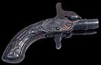 Cast iron and white metal toy cap pistol, unmarked. Example shown on right from a private collection. 18BC80